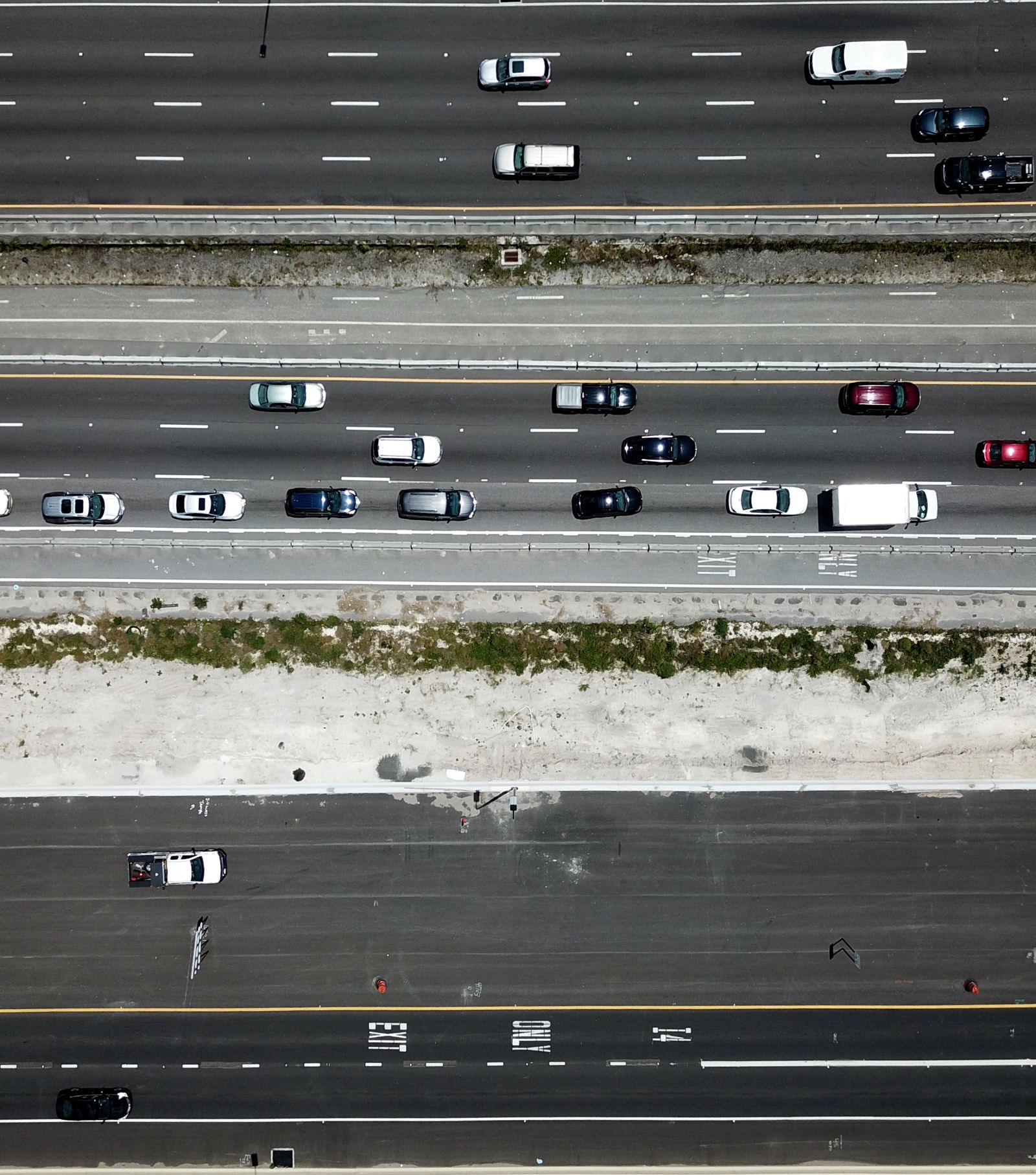 Aerial view of an Orlando expressway like the SR 408, 417, or 528 corridors serving East Orlando